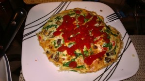 Smoked Salmon, Whipped CreamChee, Spinach and Mushrooms. Topped with some Heinz Ketchup but not needed.